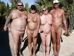 Group summer photo of mature nudist friends