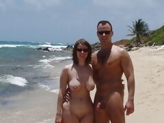 Strong Man and his busty wife are posing naked on the beach